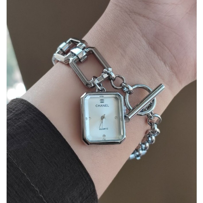 ساعت مچی زنانه بند استیل قفل تی مدل اویز رنگ ثابت شنل Chanel
