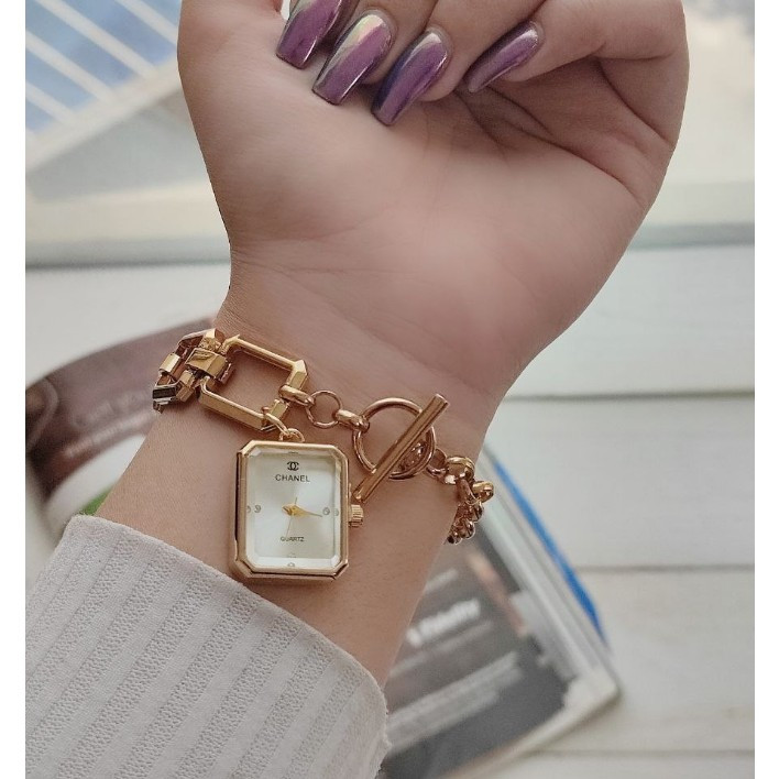 ساعت مچی زنانه بند استیل قفل تی مدل اویز رنگ ثابت شنل Chanel